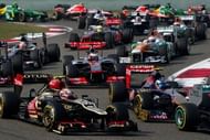 Drivers take the second corner on the first lap of the Formula One Chinese Grand Prix in Shanghai on April 14, 2013